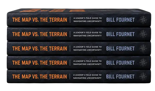 A stack of The Map vs. The Terrain hardcover copies