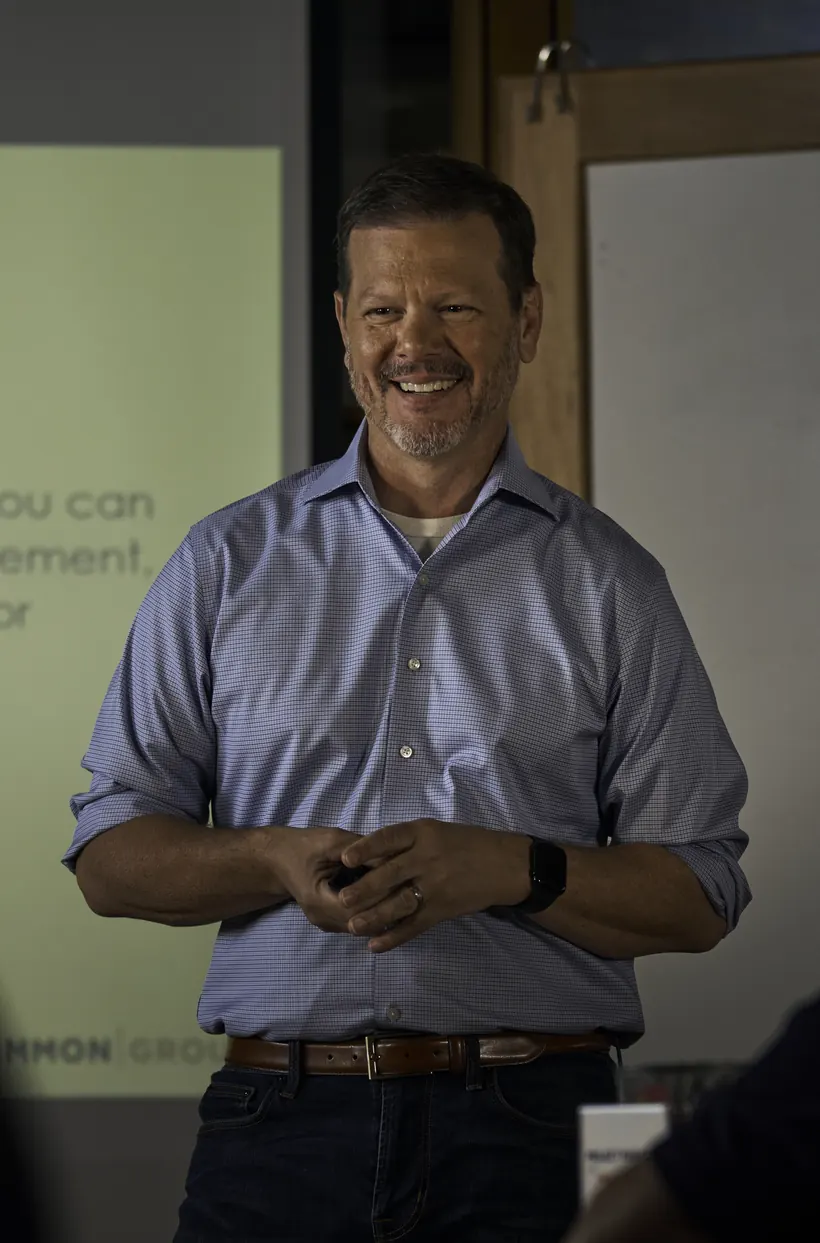Bill Fournet facilitating a leadership session in front of a projected framework