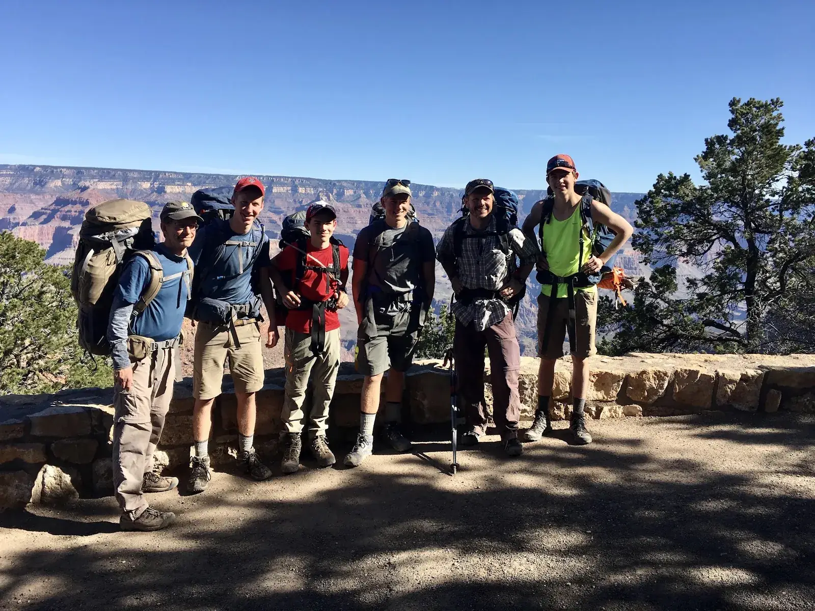 A backpacking crew of six at the rim of the Grand Canyon
